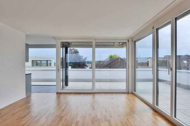 725_02_Neubau_Mehrfamilienhaus_Muenchenbuchsee_Attika_Wohnen.jpg